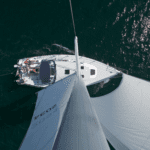 Top view of a sailboat with people on it