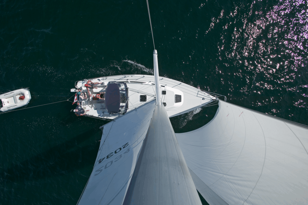 Top view of a sailboat with people on it